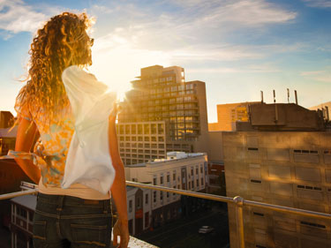 375x281-transitions-girl-on-a-rooftop